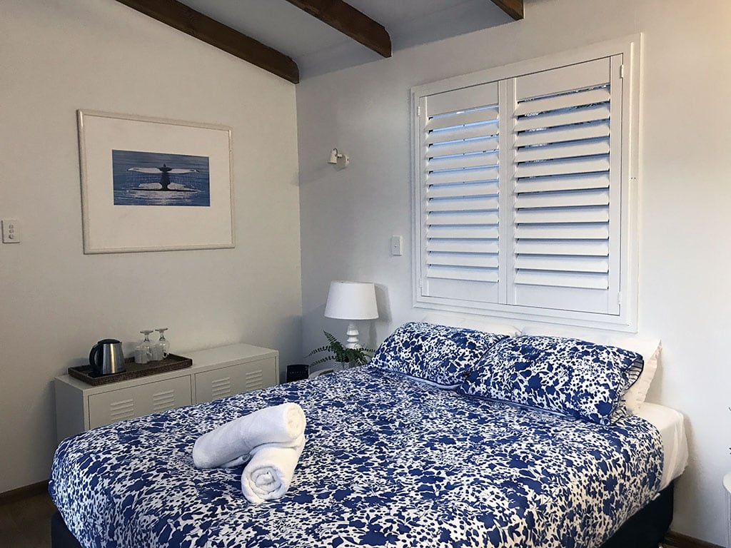 White plantation shutters for the bedroom