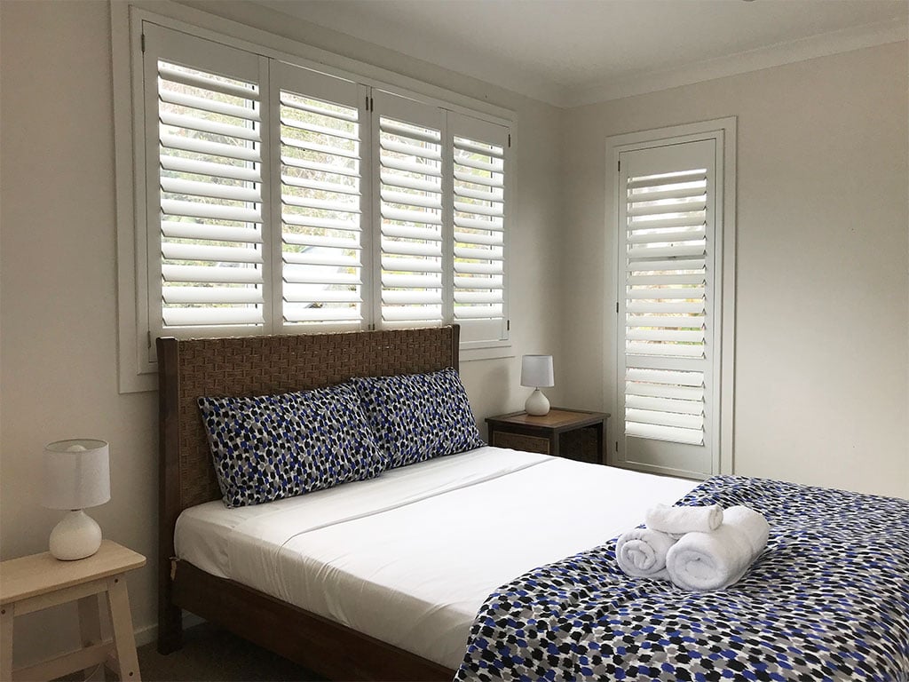 Plantation shutters for natural bedroom light